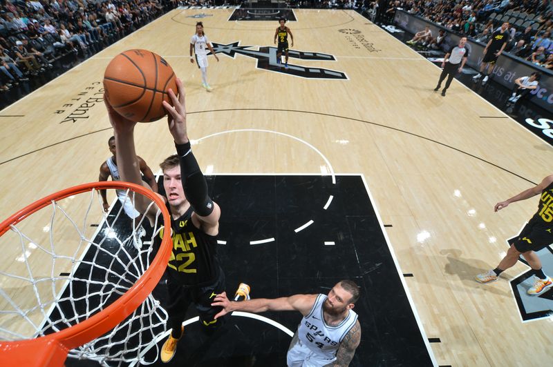 SAN ANTONIO, TX - OCTOBER 12: Kyle Filipowski #22 of the Utah Jazz dunks the ball during the game against the San Antonio Spurs during a NBA pre season game on October 12, 2024 at the Frost Bank Center in San Antonio, Texas. NOTE TO USER: User expressly acknowledges and agrees that, by downloading and or using this photograph, user is consenting to the terms and conditions of the Getty Images License Agreement. Mandatory Copyright Notice: Copyright 2024 NBAE (Photos by Michael Gonzales/NBAE via Getty Images)