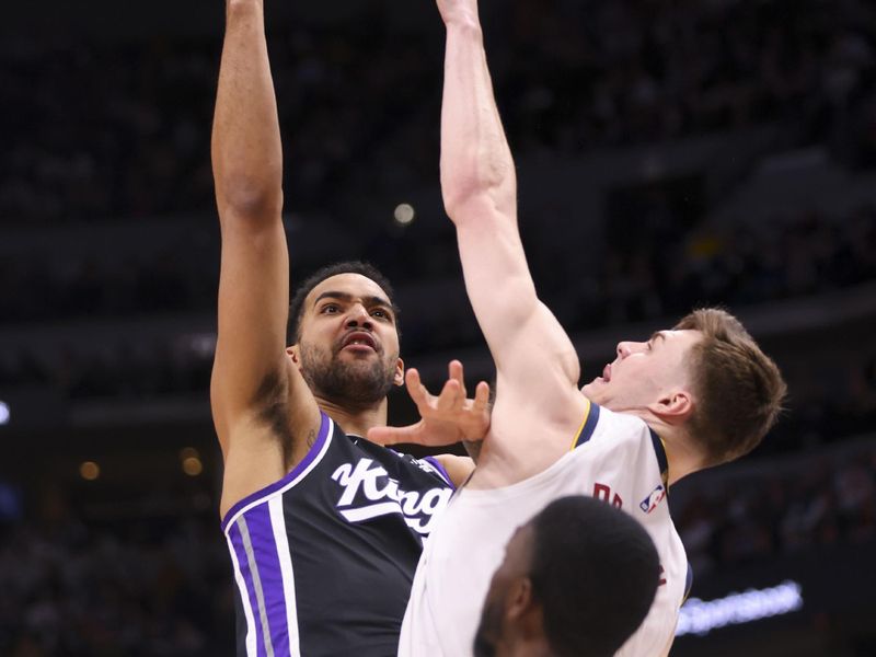 DENVER, COLORADO - FEBRUARY 28: Trey Lyles #41 of the Sacramento Kings goes to the basket while Christian Braun #0 of the Denver Nuggets defends during the game at Ball Arena on February 28, 2024 in Denver, Colorado. NOTE TO USER: User expressly acknowledges and agrees that, by downloading and or using this photograph, User is consenting to the terms and conditions of the Getty Images License Agreement. (Photo by Alysa Rubin/Clarkson Creative/Getty Images)