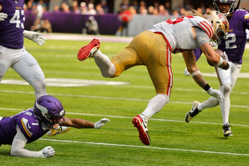 San Francisco 49ers tight end George Kittle (85) is tackled by Minnesota Vikings cornerback Byron Murphy Jr. (7) during the second half of an NFL football game, Sunday, Sept. 15, 2024, in Minneapolis. The Vikings won 23-17. (AP Photo/Bruce Kluckhohn)