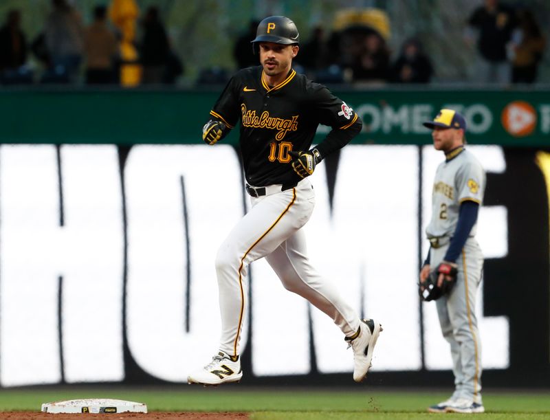 Apr 24, 2024; Pittsburgh, Pennsylvania, USA;  Pittsburgh Pirates designated hitter Bryan Reynolds (10) circles the bases on a two run home run against the Milwaukee Brewers during the third inning at PNC Park. Mandatory Credit: Charles LeClaire-USA TODAY Sports