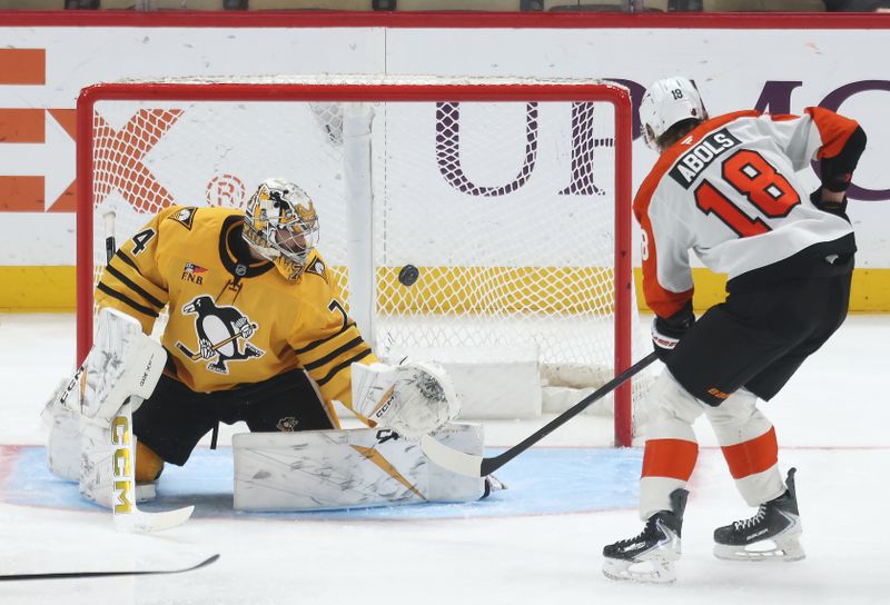 Jan 15, 2026; Pittsburgh, Pennsylvania, USA;  Philadelphia Flyers center Rodrigo Abols (18) scores a goal against Pittsburgh Penguins goaltender Stuart Skinner (74) during the second period at PPG Paints Arena. Mandatory Credit: Charles LeClaire-Imagn Images