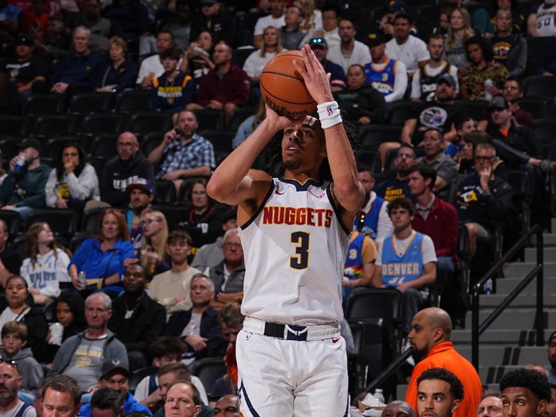 DENVER, CO - OCTOBER 13: Julian Strawther #3 of the Denver Nuggets shoots a three point basket during the game against the Phoenix Suns on October 13, 2024 at Ball Arena in Denver, Colorado. NOTE TO USER: User expressly acknowledges and agrees that, by downloading and/or using this Photograph, user is consenting to the terms and conditions of the Getty Images License Agreement. Mandatory Copyright Notice: Copyright 2024 NBAE (Photo by Bart Young/NBAE via Getty Images)