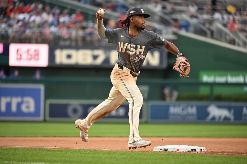 Aug 31, 2024; Washington, District of Columbia, USA; Washington Nationals third baseman Jose Tena (8) attempts a throw to first base against the Chicago Cubs during the seventh inning at Nationals Park. Mandatory Credit: Rafael Suanes-USA TODAY Sports