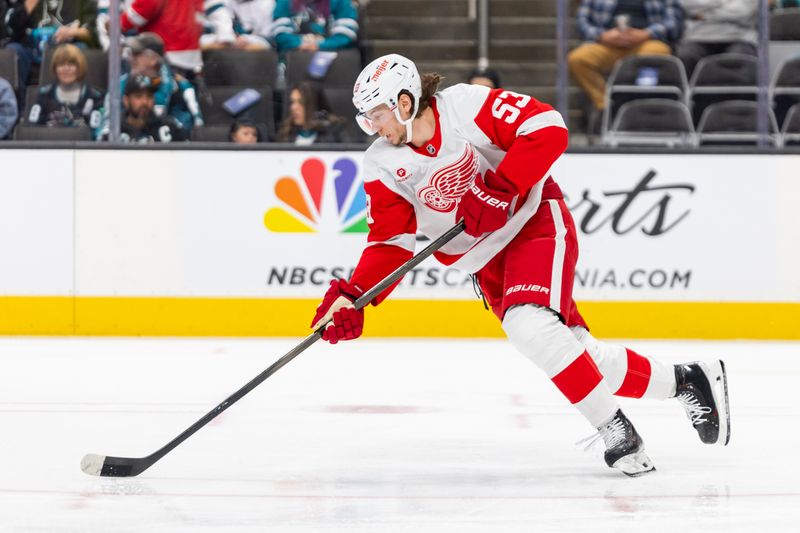 Nov 18, 2024; San Jose, California, USA; Detroit Red Wings defenseman Moritz Seider (53) skates with the puck during the third period against the San Jose Sharks at SAP Center at San Jose. Mandatory Credit: Bob Kupbens-Imagn Images