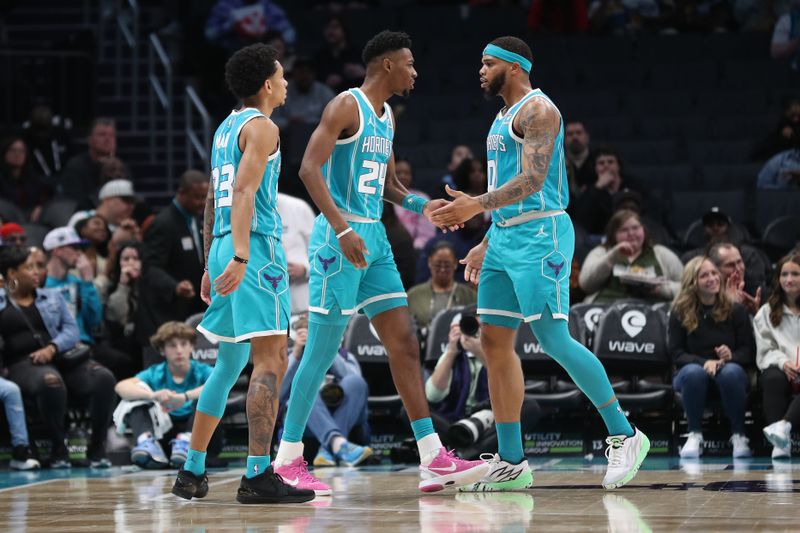 CHARLOTTE, NC - APRIL 5:  Miles Bridges #0  and Brandon Miller #24 of the Charlotte Hornets react during the game against the Orlando Magic on April 5, 2024 at Spectrum Center in Charlotte, North Carolina. NOTE TO USER: User expressly acknowledges and agrees that, by downloading and or using this photograph, User is consenting to the terms and conditions of the Getty Images License Agreement.  Mandatory Copyright Notice:  Copyright 2024 NBAE (Photo by Brock Williams-Smith/NBAE via Getty Images)