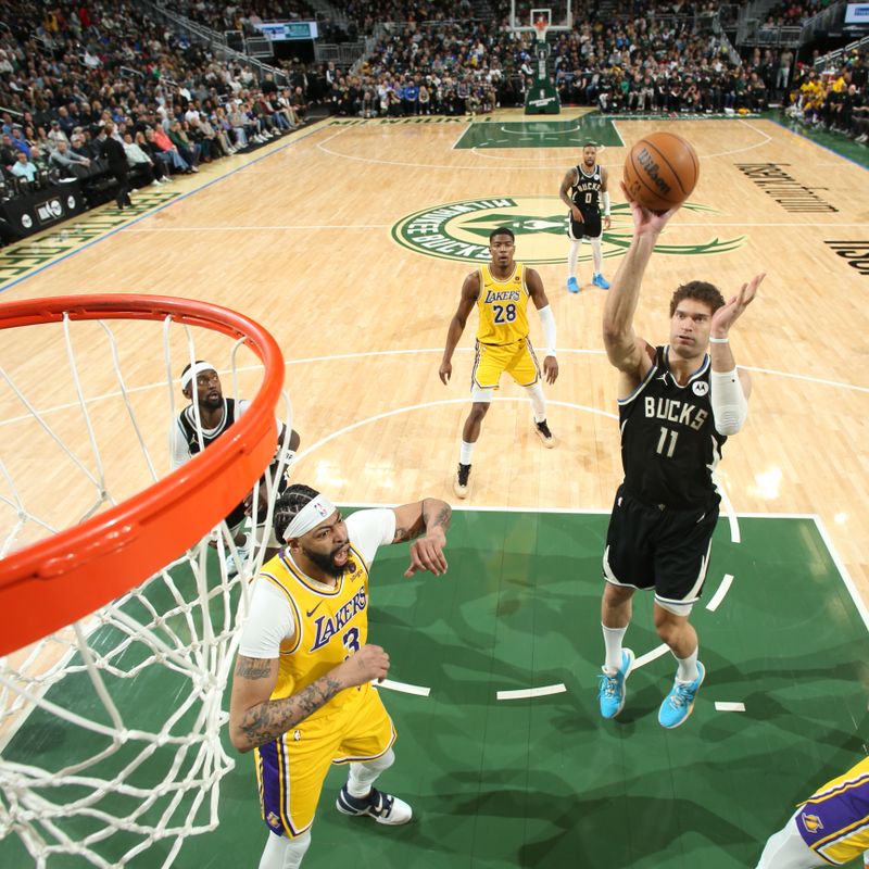 MILWAUKEE, WI - MARCH 26: Brook Lopez #11 of the Milwaukee Bucks shoots the ball during the game against the Los Angeles Lakers on March 26, 2024 at the Fiserv Forum Center in Milwaukee, Wisconsin. NOTE TO USER: User expressly acknowledges and agrees that, by downloading and or using this Photograph, user is consenting to the terms and conditions of the Getty Images License Agreement. Mandatory Copyright Notice: Copyright 2024 NBAE (Photo by Gary Dineen/NBAE via Getty Images).