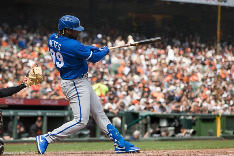 Apr 8, 2023; San Francisco, California, USA;  Kansas City Royals designated hitter Franmil Reyes (99) hits a solo home run against the San Francisco Giants during the seventh inning at Oracle Park. Mandatory Credit: John Hefti-USA TODAY Sports