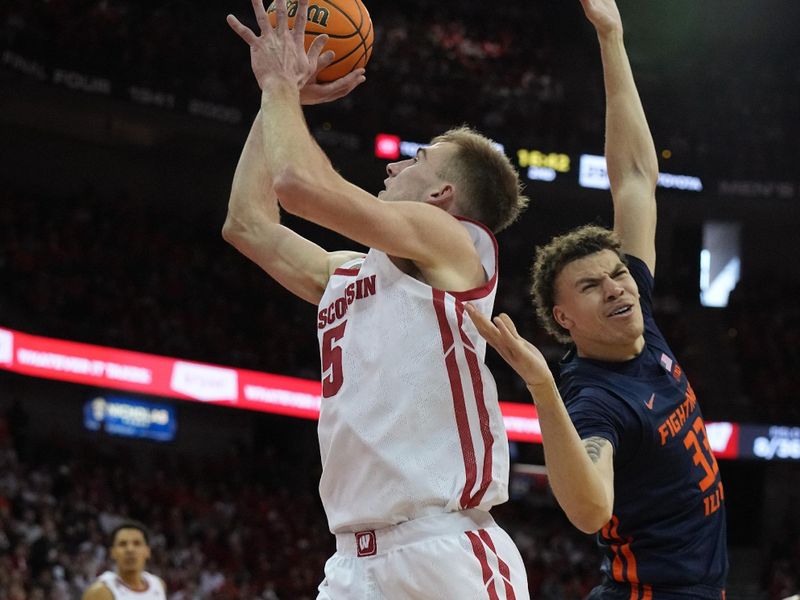 Jan 1, 2023; Madison, Wis, USA; Wisconsin forward Tyler Wahl (5) makes a move on Illinois forward Coleman Hawkins (33) during the second half of their game at the Kohl Center. Mandatory Credit: Mark Hoffman/Milwaukee Journal Sentinel via USA TODAY NETWORK