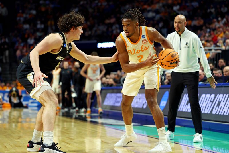 Mar 20, 2025; Lexington, KY, USA; Tennessee Volunteers guard Chaz Lanier (2) handles the ball against Wofford Terriers guard Jackson Sivills (0) during the first half in the first round of the NCAA Tournament at Rupp Arena. Mandatory Credit: Jordan Prather-Imagn Images