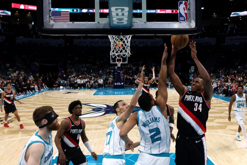 CHARLOTTE, NORTH CAROLINA - APRIL 03: Jabari Walker #34 of the Portland Trail Blazers lays the ball up during the second half against the Charlotte Hornets at Spectrum Center on April 03, 2024 in Charlotte, North Carolina. NOTE TO USER: User expressly acknowledges and agrees that, by downloading and or using this photograph, User is consenting to the terms and conditions of the Getty Images License Agreement. (Photo by David Jensen/Getty Images)