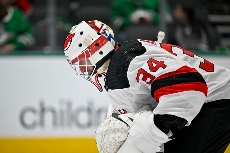 Mar 14, 2024; Dallas, Texas, USA; New Jersey Devils goaltender Jake Allen (34) prepares to face the Dallas Stars during the second period at the American Airlines Center. Mandatory Credit: Jerome Miron-USA TODAY Sports