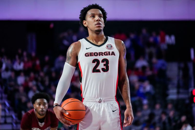 Dec 28, 2022; Athens, Georgia, USA; Georgia Bulldogs center Braelen Bridges (23) prepares to shoot a free throw against the Rider Broncs  during the first half at Stegeman Coliseum. Mandatory Credit: Dale Zanine-USA TODAY Sports