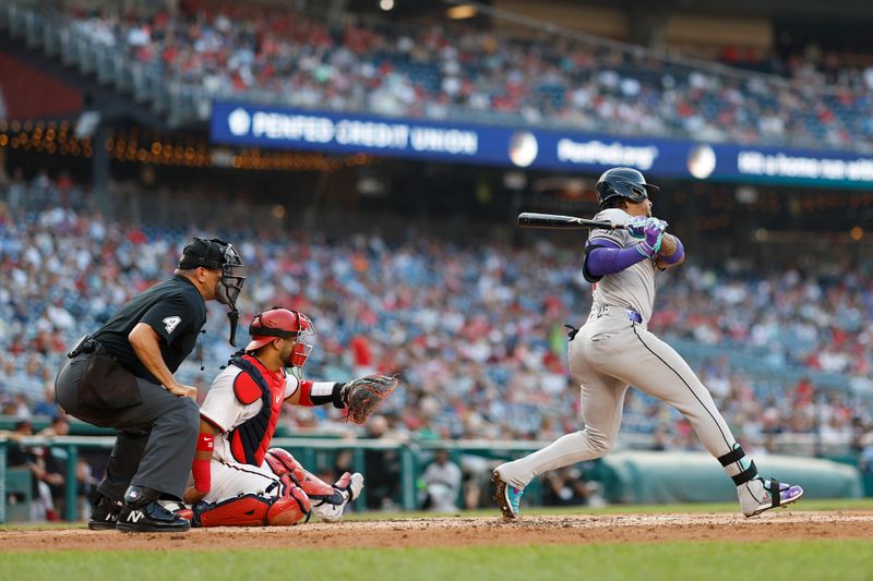 Jun 18, 2024; Washington, District of Columbia, USA; Arizona Diamondbacks second base Ketel Marte (4) singles against the Washington Nationals during the third inning at Nationals Park. Mandatory Credit: Geoff Burke-USA TODAY Sports