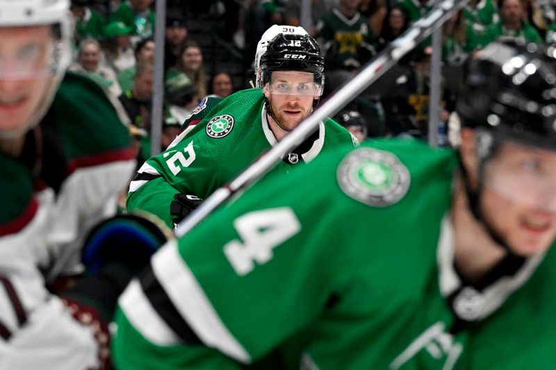 Mar 20, 2024; Dallas, Texas, USA; Dallas Stars center Radek Faksa (12) looks for the puck in the Arizona Coyotes zone during the second period at the American Airlines Center. Mandatory Credit: Jerome Miron-USA TODAY Sports