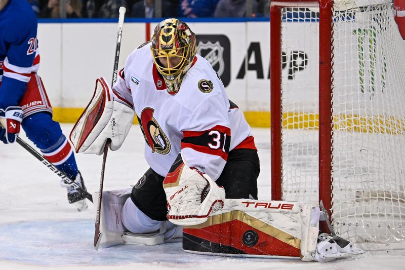 Jan 21, 2025; New York, New York, USA;  Ottawa Senators goaltender Anton Forsberg (31) makes a save against the New York Rangers during the second period at Madison Square Garden. Mandatory Credit: Dennis Schneidler-Imagn Images