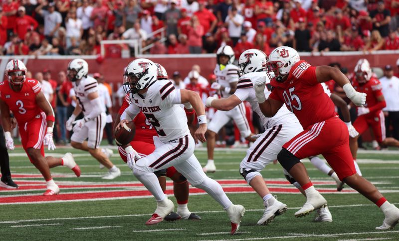 Sep 20, 2025; Salt Lake City, Utah, USA; Texas Tech Red Raiders quarterback Behren Morton (2) is forced out of the pocket by Utah Utes defensive tackle Aliki Vimahi (95) during the second quarter at Rice-Eccles Stadium. Mandatory Credit: Rob Gray-Imagn Images