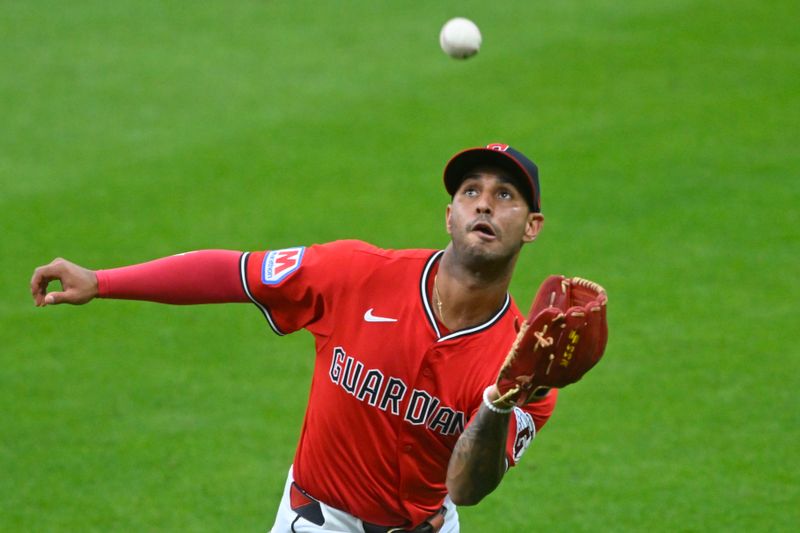 Jul 30, 2025; Cleveland, Ohio, USA; Cleveland Guardians second base Brayan Rocchio (4) catches a fly ball in the sixth inning against the Colorado Rockies at Progressive Field. Mandatory Credit: David Richard-Imagn Images