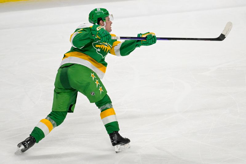 Feb 17, 2024; Saint Paul, Minnesota, USA;  Minnesota Wild defenseman Declan Chisholm (47) scores a power play goal against the Buffalo Sabres during the third period at Xcel Energy Center. Mandatory Credit: Nick Wosika-USA TODAY Sports