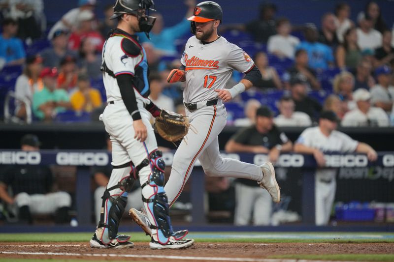 Jul 25, 2024; Miami, Florida, USA;  Baltimore Orioles center fielder Colton Cowser (17) scores a run against the Miami Marlins in the second inning at loanDepot Park. Mandatory Credit: Jim Rassol-USA TODAY Sports