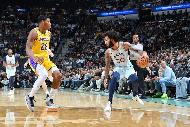 SAN ANTONIO, TX - NOVEMBER 27: Julian Champagnie #30 of the San Antonio Spurs dribbles the ball during the game against the Los Angeles Lakers on November 27, 2024 at the Frost Bank Center in San Antonio, Texas. NOTE TO USER: User expressly acknowledges and agrees that, by downloading and or using this photograph, user is consenting to the terms and conditions of the Getty Images License Agreement. Mandatory Copyright Notice: Copyright 2024 NBAE (Photos by Michael Gonzales/NBAE via Getty Images)