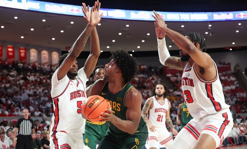 Feb 10, 2025; Houston, Texas, USA; Baylor Bears forward Norchad Omier (15) is guarded by Houston Cougars forward Ja'Vier Francis (5)  and  forward J'Wan Roberts (13) in the second half at Fertitta Center. Mandatory Credit: Thomas Shea-Imagn Images
