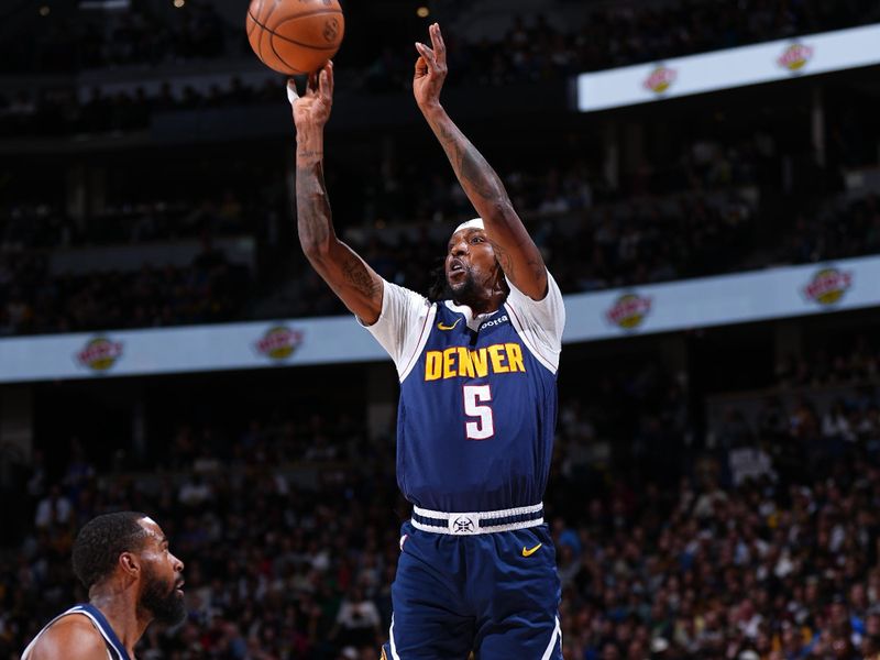 DENVER, CO - APRIL 10: Kentavious Caldwell-Pope #5 of the Denver Nuggets shoots the ball during the game against the Minnesota Timberwolves on April 10, 2024 at the Ball Arena in Denver, Colorado. NOTE TO USER: User expressly acknowledges and agrees that, by downloading and/or using this Photograph, user is consenting to the terms and conditions of the Getty Images License Agreement. Mandatory Copyright Notice: Copyright 2024 NBAE (Photo by Garrett Ellwood/NBAE via Getty Images)