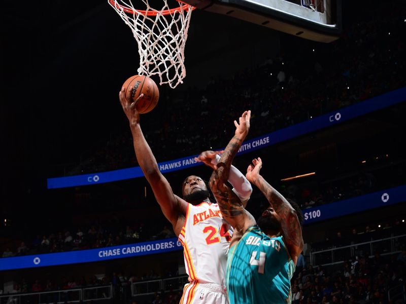 ATLANTA, GA - MARCH 23: Bruno Fernando #24 of the Atlanta Hawks drives to the basket during the game against the Charlotte Hornets on March 23, 2024 at State Farm Arena in Atlanta, Georgia.  NOTE TO USER: User expressly acknowledges and agrees that, by downloading and/or using this Photograph, user is consenting to the terms and conditions of the Getty Images License Agreement. Mandatory Copyright Notice: Copyright 2024 NBAE (Photo by Scott Cunningham/NBAE via Getty Images)