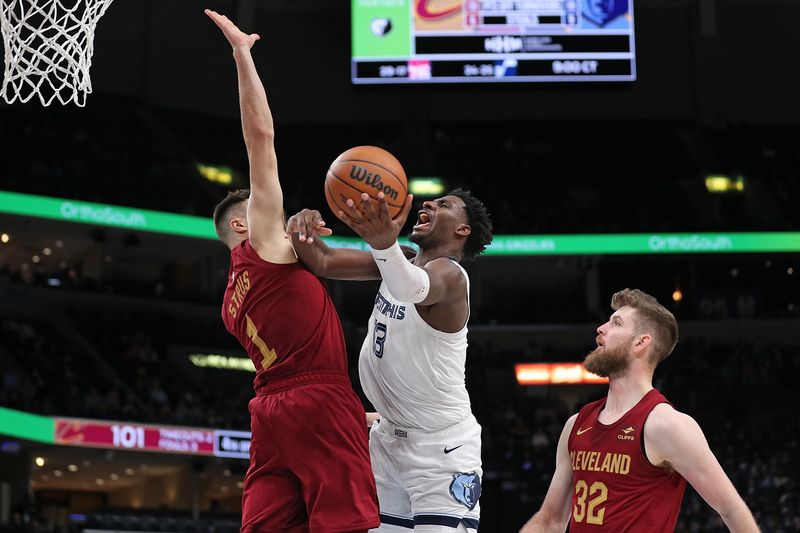 MEMPHIS, TENNESSEE - FEBRUARY 01: Jaren Jackson Jr. #13 of the Memphis Grizzlies goes to the basket against Max Strus #1 of the Cleveland Cavaliers during the second half at FedExForum on February 01, 2024 in Memphis, Tennessee. NOTE TO USER: User expressly acknowledges and agrees that, by downloading and or using this photograph, User is consenting to the terms and conditions of the Getty Images License Agreement. (Photo by Justin Ford/Getty Images)