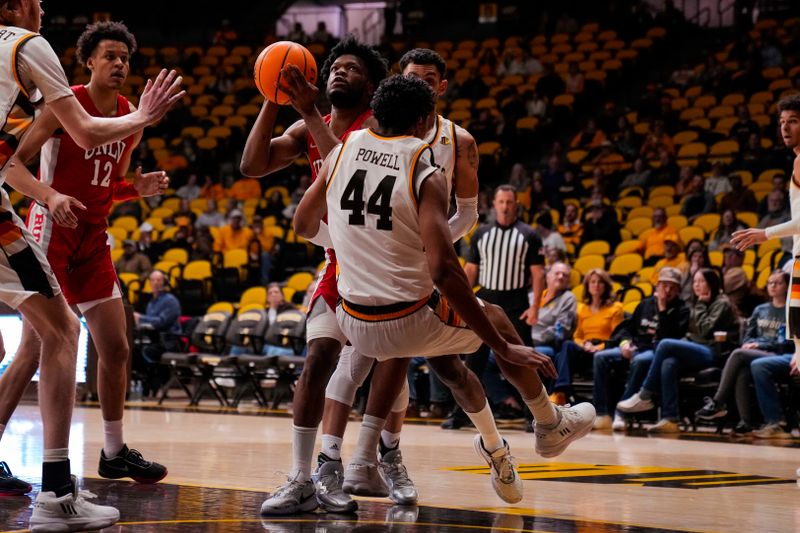 Feb 8, 2023; Laramie, Wyoming, USA; UNLV Runnin' Rebels guard EJ Harkless (55) is called for a charge against Wyoming Cowboys forward Caden Powell (44) during the first half at Arena-Auditorium. Mandatory Credit: Troy Babbitt-USA TODAY Sports