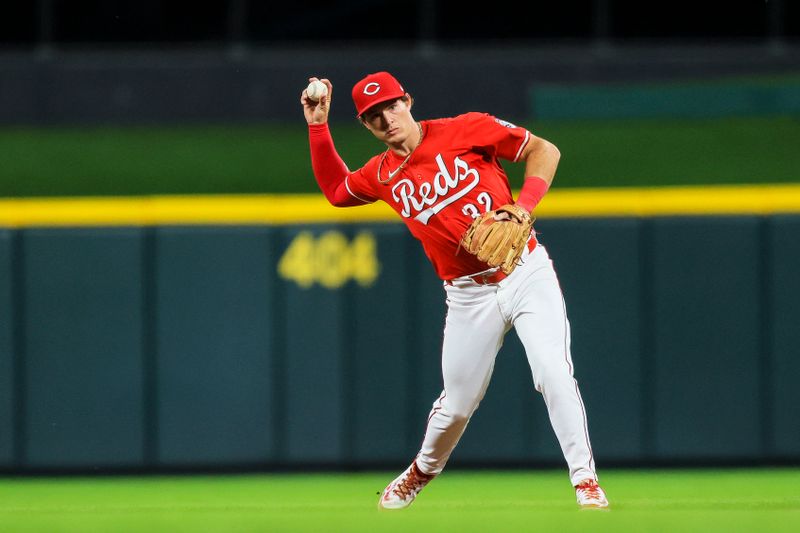 Apr 30, 2025; Cincinnati, Ohio, USA; Cincinnati Reds second baseman Tyler Callihan (32) throws to first to get St. Louis Cardinals catcher Pedro Pages (not pictured) out in the eighth inning at Great American Ball Park. Mandatory Credit: Katie Stratman-Imagn Images