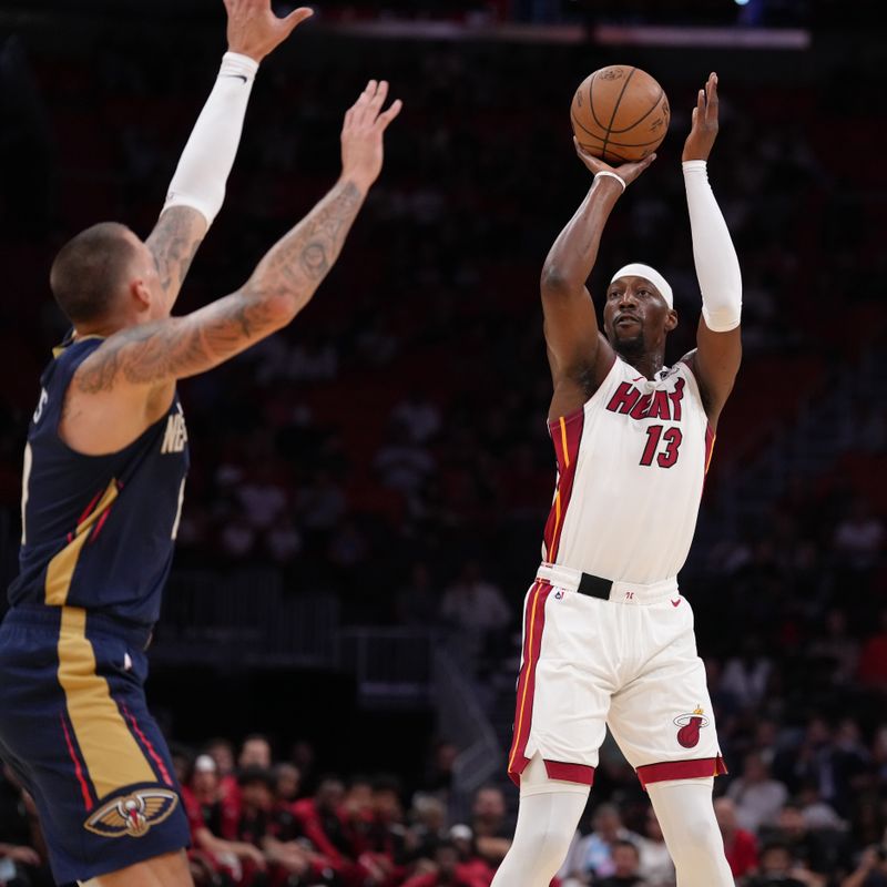 MIAMI, FL - OCTOBER 13:  Bam Adebayo #13 of the Miami Heat shoots the ball during the game against the New Orleans Pelicans during a preseason game on October 13, 2024 at Kaseya Center in Miami, Florida. NOTE TO USER: User expressly acknowledges and agrees that, by downloading and or using this Photograph, user is consenting to the terms and conditions of the Getty Images License Agreement. Mandatory Copyright Notice: Copyright 2024 NBAE (Photo by Eric Espada/NBAE via Getty Images)