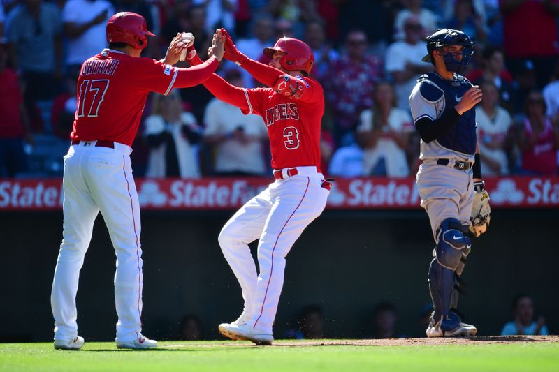 Jul 19, 2023; Anaheim, California, USA; Los Angeles Angels left fielder Taylor Ward (3) is greeted by designated hitter Shohei Ohtani (17) after hitting a two run home run against the New York Yankees during the first inning at Angel Stadium. Mandatory Credit: Gary A. Vasquez-USA TODAY Sports
