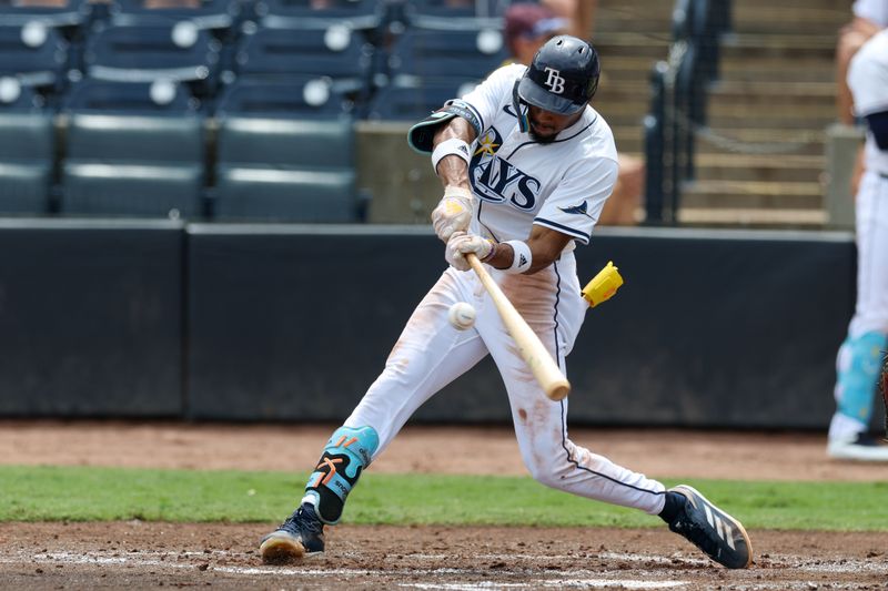 Sep 18, 2025; Tampa, Florida, USA; Tampa Bay Rays center fielder Chandler Simpson (14) hits an hits an rbi single against the Toronto Blue Jays in the second inning  at George M. Steinbrenner Field. Mandatory Credit: Nathan Ray Seebeck-Imagn Images