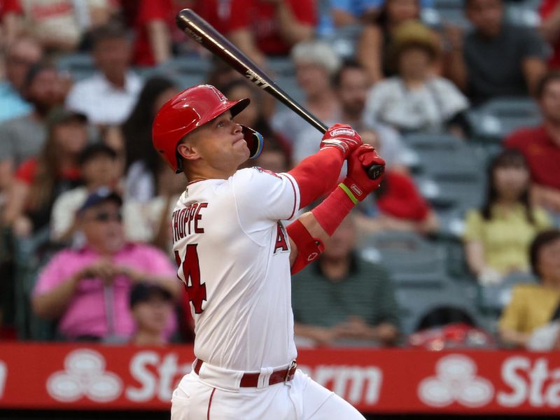 Sep 9, 2023; Anaheim, California, USA;  Los Angeles Angels catcher Logan O'Hoppe (14) hits a two-run home run during the first inning against the Cleveland Guardians at Angel Stadium. Mandatory Credit: Kiyoshi Mio-USA TODAY Sports