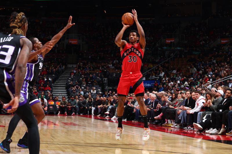 TORONTO, CANADA - MARCH 20: Ochai Agbaji #30 of the Toronto Raptors shoots the ball during the game against the Sacramento Kings on March 20, 2024 at the Scotiabank Arena in Toronto, Ontario, Canada.  NOTE TO USER: User expressly acknowledges and agrees that, by downloading and or using this Photograph, user is consenting to the terms and conditions of the Getty Images License Agreement.  Mandatory Copyright Notice: Copyright 2024 NBAE (Photo by Vaughn Ridley/NBAE via Getty Images)