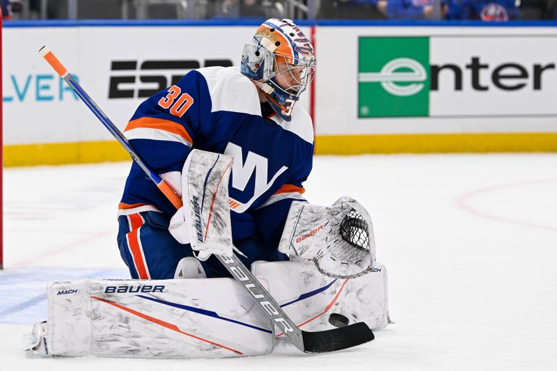 Mar 5, 2024; Elmont, New York, USA;  New York Islanders goaltender Ilya Sorokin (30) makes a save against the St. Louis Blues during the first period at UBS Arena. Mandatory Credit: Dennis Schneidler-USA TODAY Sports