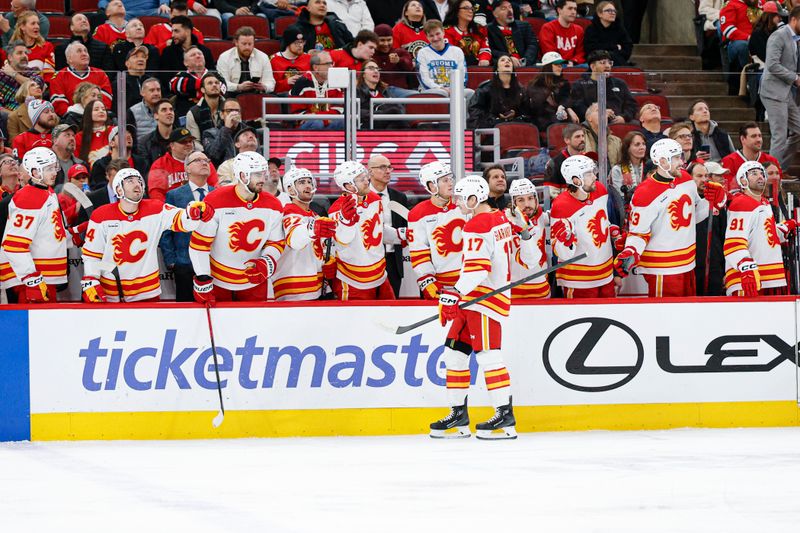 Jan 15, 2026; Chicago, Illinois, USA; Calgary Flames center Yegor Sharangovich (17) celebrates with teammates after scoring against the Chicago Blackhawks during the first period at United Center. Mandatory Credit: Kamil Krzaczynski-Imagn Images