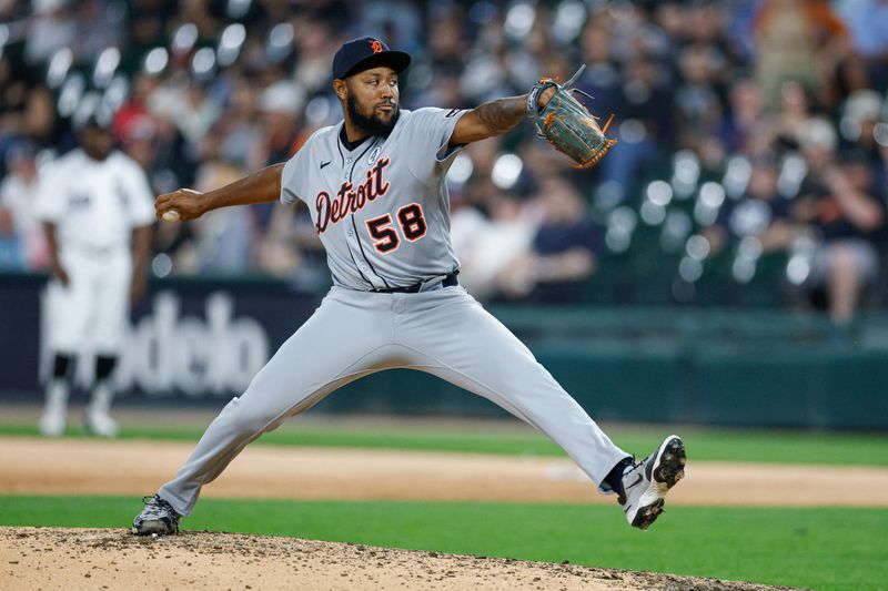 Jun 2, 2025; Chicago, Illinois, USA; Detroit Tigers relief pitcher Dylan Smith (58) delivers a pitch against the Chicago White Sox during the seventh inning at Rate Field. Mandatory Credit: Kamil Krzaczynski-Imagn Images