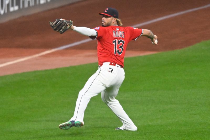 Sep 25, 2025; Cleveland, Ohio, USA; Cleveland Guardians shortstop Gabriel Arias (13) throws the ball to the infield in the fifth inning against the Detroit Tigers at Progressive Field. Mandatory Credit: David Richard-Imagn Images