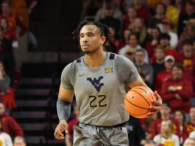 Feb 24, 2024; Ames, Iowa, USA; West Virginia Mountaineers forward Josiah Harris (22) sets the offense against the Iowa State Cyclones during the second half at James H. Hilton Coliseum. Mandatory Credit: Reese Strickland-USA TODAY Sports