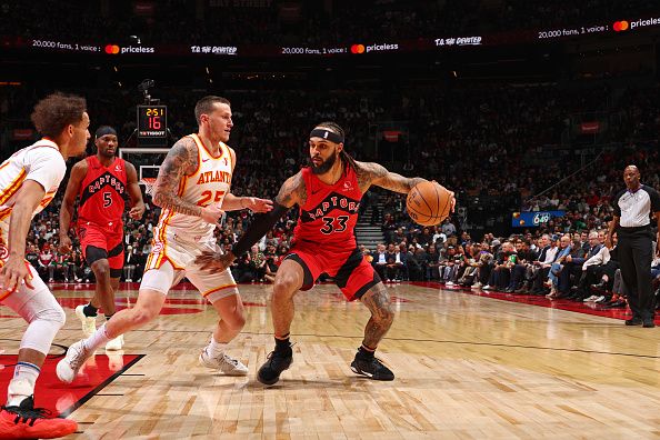 TORONTO, CANADA - DECEMBER 13: Gary Trent Jr. #33 of the Toronto Raptors handles the ball during the game against the Atlanta Hawks on December 13, 2023 at the Scotiabank Arena in Toronto, Ontario, Canada.  NOTE TO USER: User expressly acknowledges and agrees that, by downloading and or using this Photograph, user is consenting to the terms and conditions of the Getty Images License Agreement.  Mandatory Copyright Notice: Copyright 2023 NBAE (Photo by Vaughn Ridley/NBAE via Getty Images)