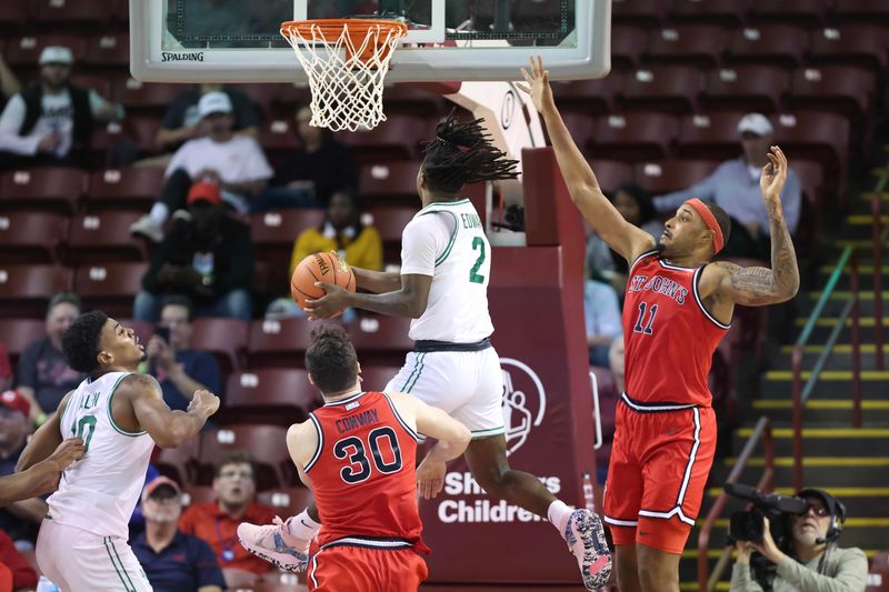 Nov 16, 2023; Charleston, South Carolina, USA; North Texas Mean Green guard Jason Edwards (2) shoots the ball over St. John's Red Storm center Joel Soriano (11) in the second half at TD Arena. Mandatory Credit: David Yeazell-USA TODAY Sports