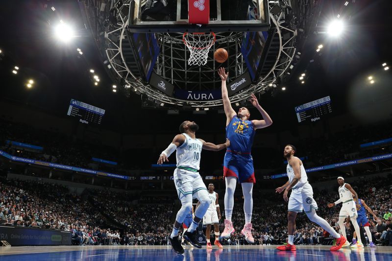 MINNEAPOLIS, MN -  MARCH 19: Nikola Jokic #15 of the Denver Nuggets shoots the ball during the game against the Minnesota Timberwolves on March 19, 2024 at Target Center in Minneapolis, Minnesota. NOTE TO USER: User expressly acknowledges and agrees that, by downloading and or using this Photograph, user is consenting to the terms and conditions of the Getty Images License Agreement. Mandatory Copyright Notice: Copyright 2024 NBAE (Photo by David Sherman/NBAE via Getty Images)