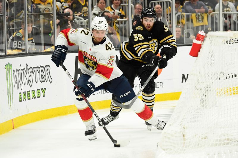 May 17, 2024; Boston, Massachusetts, USA; Florida Panthers defenseman Gustav Forsling (42) skates with the puck ahead of Boston Bruins right wing Justin Brazeau (55) during the third period in game six of the second round of the 2024 Stanley Cup Playoffs at TD Garden. Mandatory Credit: Bob DeChiara-USA TODAY Sports