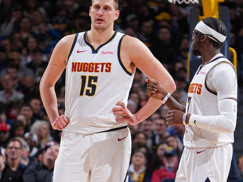 DENVER, CO - FEBRUARY 28: Nikola Jokic #15 and Reggie Jackson #7 of the Denver Nuggets talk during the game against the Sacramento Kings on February 28, 2024 at the Ball Arena in Denver, Colorado. NOTE TO USER: User expressly acknowledges and agrees that, by downloading and/or using this Photograph, user is consenting to the terms and conditions of the Getty Images License Agreement. Mandatory Copyright Notice: Copyright 2024 NBAE (Photo by Garrett Ellwood/NBAE via Getty Images)