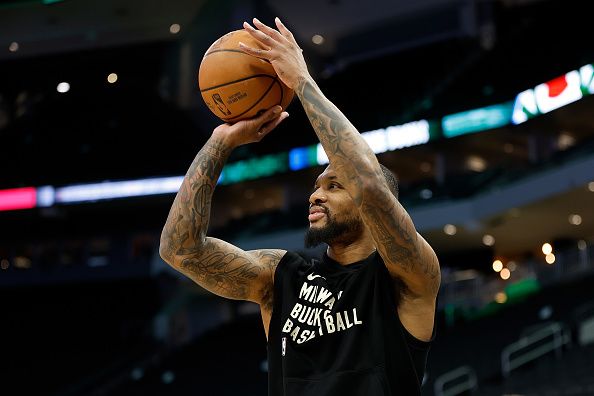 MILWAUKEE, WISCONSIN - DECEMBER 17: Damian Lillard #0 of the Milwaukee Bucks warms up before the game against the Houston Rockets at Fiserv Forum on December 17, 2023 in Milwaukee, Wisconsin. NOTE TO USER: User expressly acknowledges and agrees that, by downloading and or using this photograph, User is consenting to the terms and conditions of the Getty Images License Agreement. (Photo by John Fisher/Getty Images)