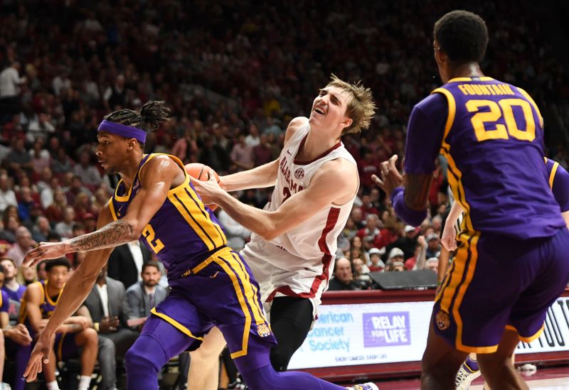 Jan 27, 2024; Tuscaloosa, Alabama, USA;  LSU guard Mike Williams III (2) fouls Alabama forward Grant Nelson (2) as he attempts to get to the basket at Coleman Coliseum. Mandatory Credit: Gary Cosby Jr.-USA TODAY Sports