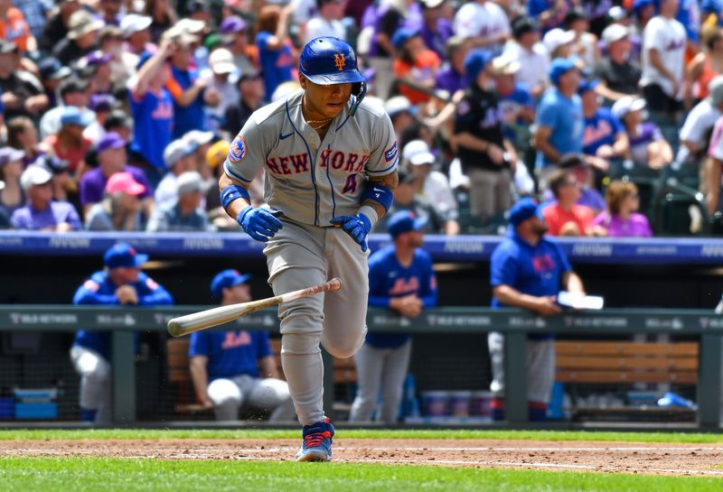 May 28, 2023; Denver, Colorado, USA; New York Mets catcher Francisco Alvarez (4) flips his bat after hitting a 420 ft. home run in the fourth inning against the Colorado Rockies at Coors Field. Mandatory Credit: John Leyba-USA TODAY Sports