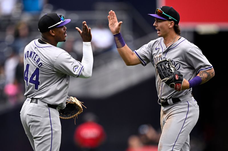 May 15, 2024; San Diego, California, USA; Colorado Rockies left fielder Jordan Beck (27) celebrates with first baseman Elehuris Montero (44) after defeating the San Diego Padres at Petco Park. Mandatory Credit: Orlando Ramirez-USA TODAY Sports