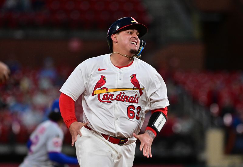 May 4, 2025; St. Louis, Missouri, USA; St. Louis Cardinals catcher Yohel Pozo (63) advances to third base in the ninth inning against the New York Mets at Busch Stadium. Mandatory Credit: Tim Vizer-Imagn Images